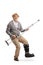 Full length portrait of a mature man with a leg orthopedic brace playing a guitar with a crutch