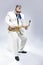 Full Length Portrait of Passionate Expressive Male Alto Saxophone Player in White Suit