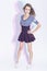 Full Length Portrait of Positive Caucasian Brunette Girl In Trendy Striped Blue Dress