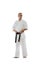 Full-length portrait of professional karateka in kimono with black belth isolated over white background. Karate, judo
