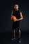 Full length portrait of a serious african sportsman playing basketball