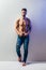 Full length portrait of sexy muscular shirtless man