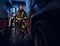 Full-length portrait of two brave firemen in protective uniform walking between two fire engines in the garage of the