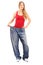 Full length portrait of a weigh loss female with old pair of jeans