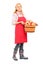 Full length portrait of a woman with apron holding a bucket full