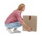 Full length portrait of woman lifting carton box