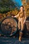 Full length portrait of woman standing in autumn vineyard