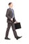 Full length portrait of a young businessman with briefcase walking