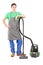 Full length portrait of a young man with a vacuum cleaner