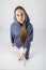 Full length portrait of young sporty fitness women in blue cotton hooded sweatsuit casual outfit. studio shot of blonde