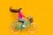Full length profile photo of cute girl ride bike wildflowers pot wear pink sweater jeans  yellow color