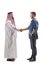 Full length profile shot of an arab man shaking hand with a casual young man