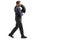 Full length profile shot of an auto mechanic carrying a tire on his shoulder