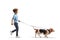 Full length profile shot of a boy walking a basset hound dog on a lead