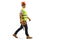 Full length profile shot of a construction worker with a helmet and tool belt walking