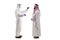 Full length profile shot of an epidemiologist in a hazmat suit  testing an arab man for covid-19