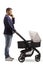Full length profile shot of a father with a baby carriage making a phone call