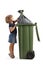 Full length profile shot of a little girl putting a waste bag in a plastic bin