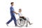 Full length profile shot of a male healthcare worker pushing a female patient in a wheelchair