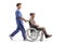 Full length profile shot of a male nurse pushing a elderly man in a wheelchair