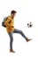 Full length profile shot of a male teenage student kicking a soccer ball