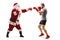 Full length profile shot of a man boxer and santa claus fighting with boxing gloves