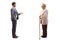 Full length profile shot of a man in a suit talking to his elderly mother