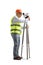 Full length profile shot of a mature geodetic surveyor measuring with a positioning station