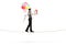 Full length profile shot of a mime walking on a rope and carrying balloons and a gift box