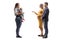 Full length profile shot of a mother with a baby in a carrier and an expecting couple having a conversation