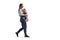 Full length profile shot of a mother walking and carrying a baby in a carrier