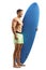 Full length profile shot of a muscular surfer carrying a surfboard