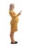 Full length profile shot of a pregnant woman typing on a smartphone