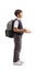 Full length profile shot of a schoolboy standing, gesturing with hands and carrying a backpack