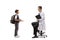 Full length profile shot of a schoolboy talking to a male doctor seated on a chair