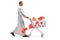 Full length profile shot of a young muslim man walking and pushing a shopping cart with red hearts inside