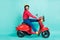 Full length profile side photo of brunette excited man ride motorbike speed  on teal color background