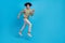 Full length profile side photo of young guy run rush motion energetic discount isolated over blue color background