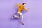 Full length profile side photo of young man happy positive smile jump go walk run hurry isolated over purple color