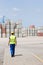 Full-length rear view of male worker walking in shipping yard