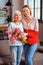 Full-length shot grey-haired dame posing with lady in pinkish blouse