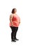 Full length shot of an overweight woman standing and measuring waist