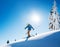 Full length shot of a professional freeride skier skiing on top of the mountain