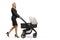 Full length shot of a professional woman pushing a baby stroller