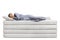 Full length shot of a young man sleeping peacefully on  a pile of soft mattresses