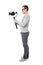 Full length side view of professional videographer using dslr camera on gimbal stabilizer isolated on white