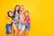 Full length size body photo of four delightful kind nice glad optimistic cheerful ladies enjoying time together isolated