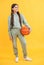 full length of teen basketball girl isolated on yellow. teen basketball girl in studio.