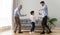 Full-length three generations of men dancing in living room