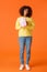 Full-length vertical shot cute and friendly african-american girl prepared gift for girlfriend, standing with wrapped